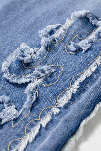 Light Wash Blue high rise Western flare jeans with embroidered lower-leg detailing and full-length wide leg silhouette.