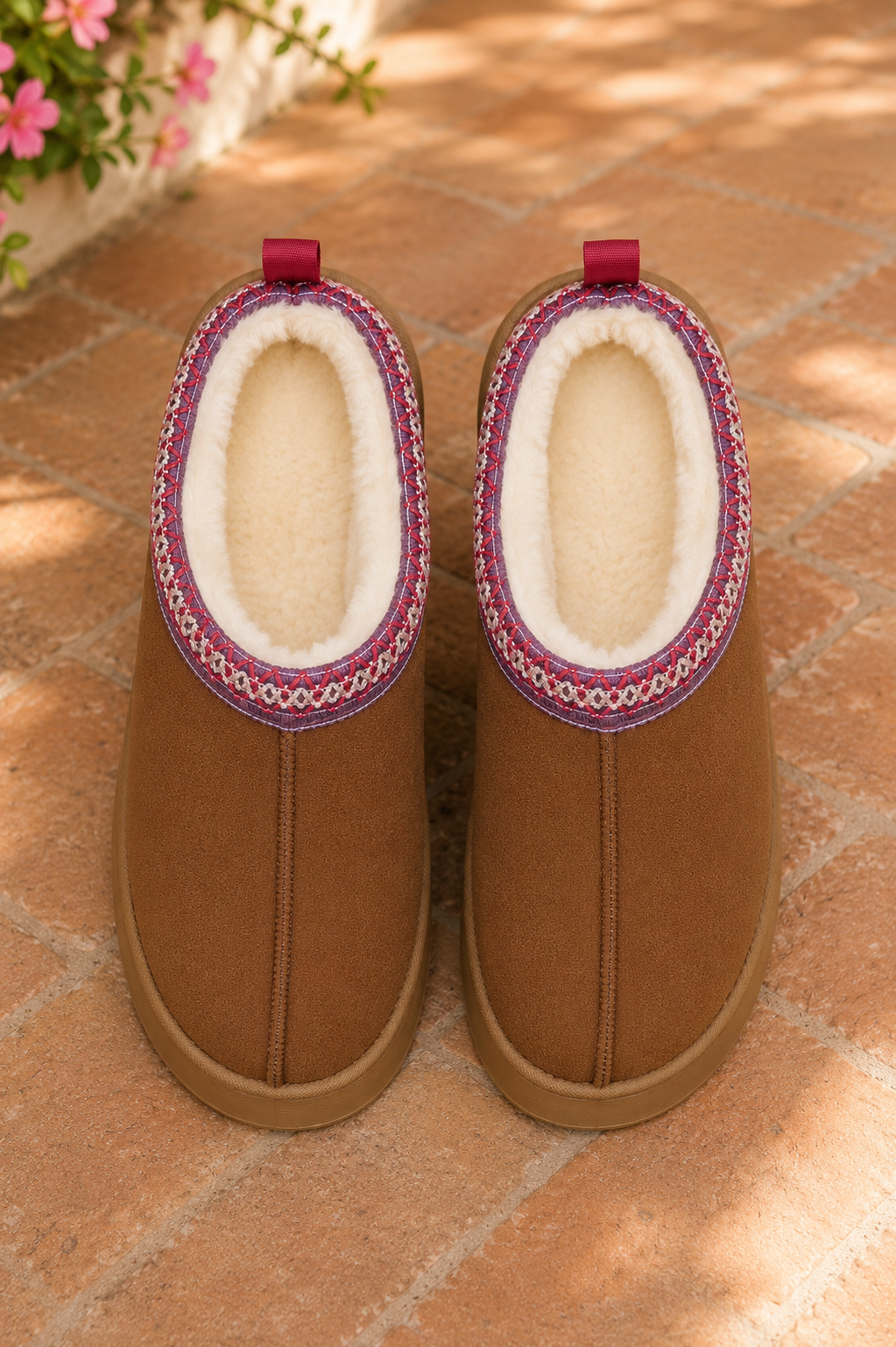 Chestnut brown faux-suede platform slippers with cream plush lining, round toes, and decorative stitched collar trim