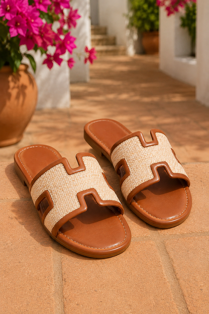 Women's Chestnut woven H-cut flat slide sandals with raffia-inspired texture, faux leather trim, open toe, and comfortable slip-on design.