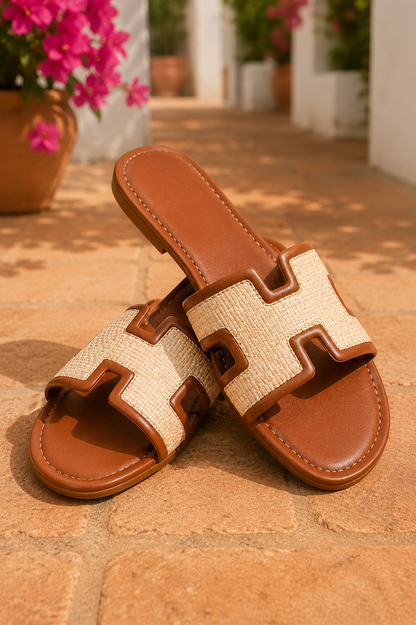 Women's Chestnut woven H-cut flat slide sandals with raffia-inspired texture, faux leather trim, open toe, and comfortable slip-on design.