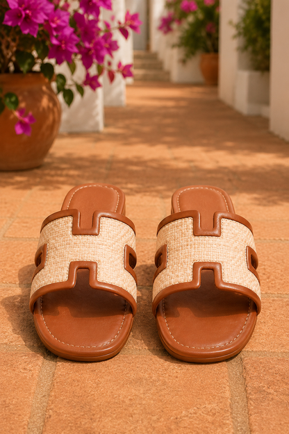 Women's Chestnut woven H-cut flat slide sandals with raffia-inspired texture, faux leather trim, open toe, and comfortable slip-on design.