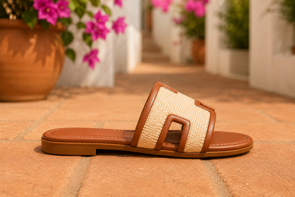 Women's Chestnut woven H-cut flat slide sandals with raffia-inspired texture, faux leather trim, open toe, and comfortable slip-on design.