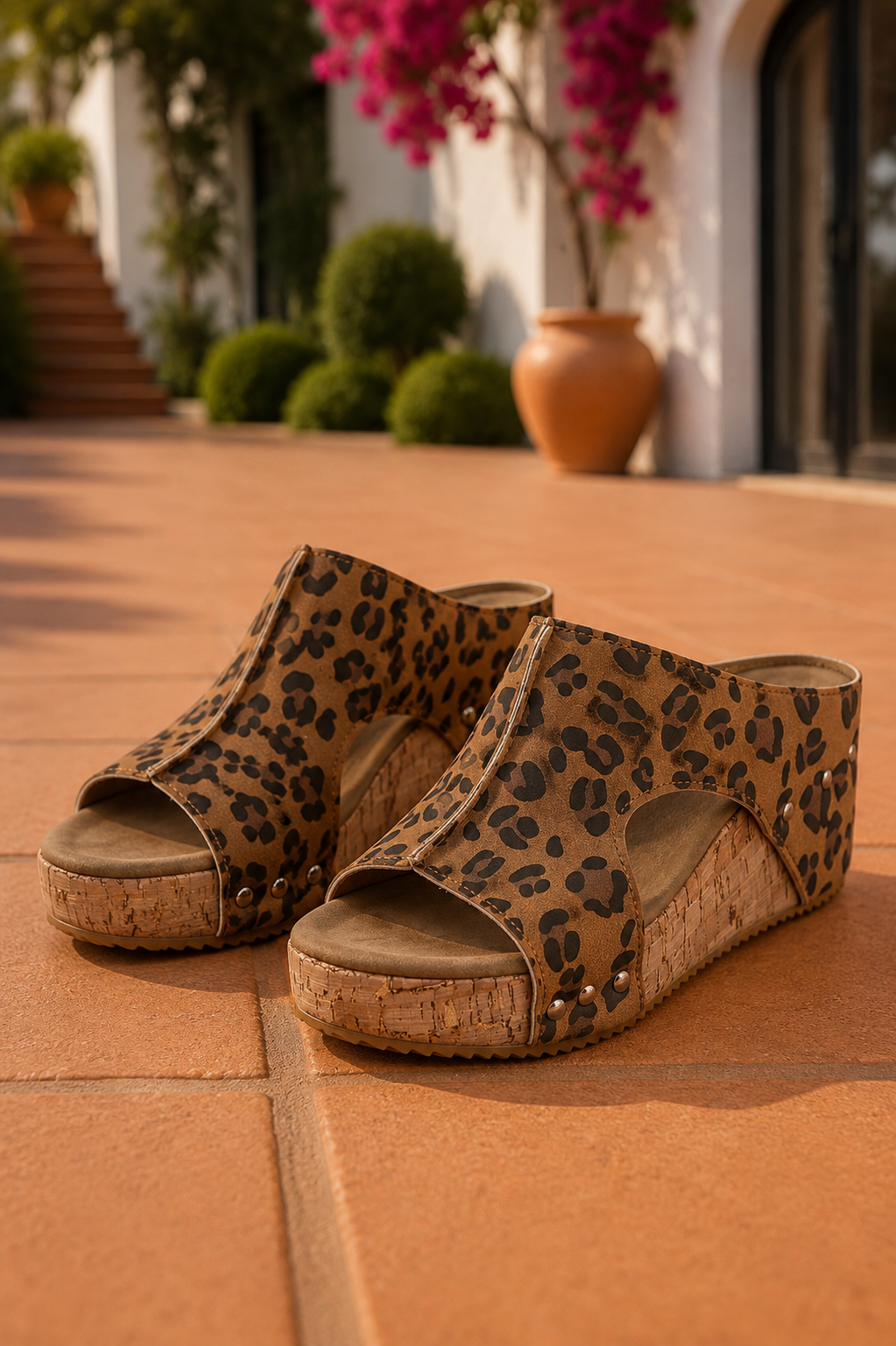Women's chestnut leopard print faux suede cork platform wedge slide sandals with open toe and side cutout details.