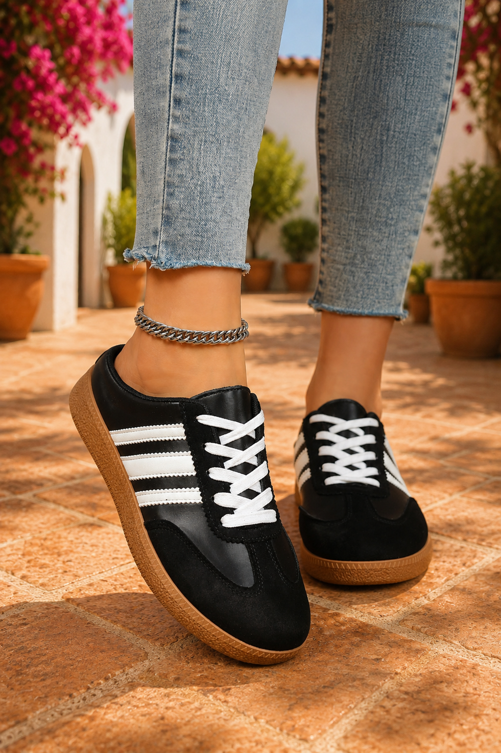 Women's Midnight Noir retro lace-up casual sneakers featuring a black faux leather upper, suede-look overlays, white side stripes, white laces, and a gum rubber sole.