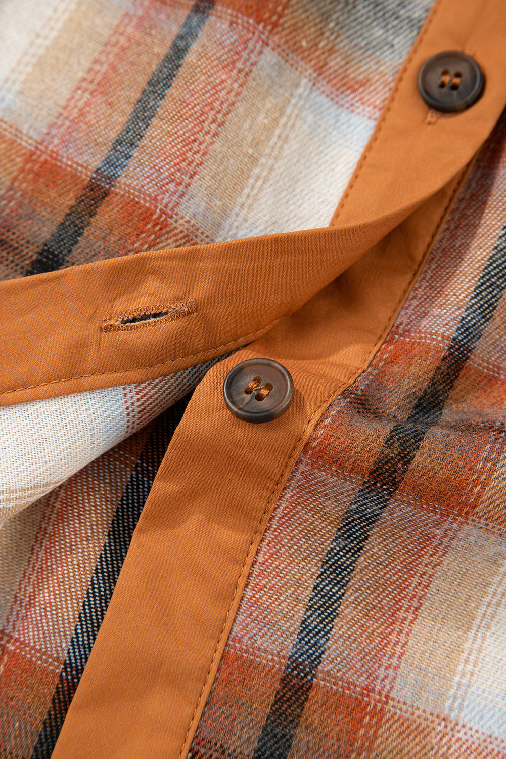 Caramel plaid tunic shirt dress with collared neckline, button front, chest pockets, long sleeves, and relaxed mini silhouette.