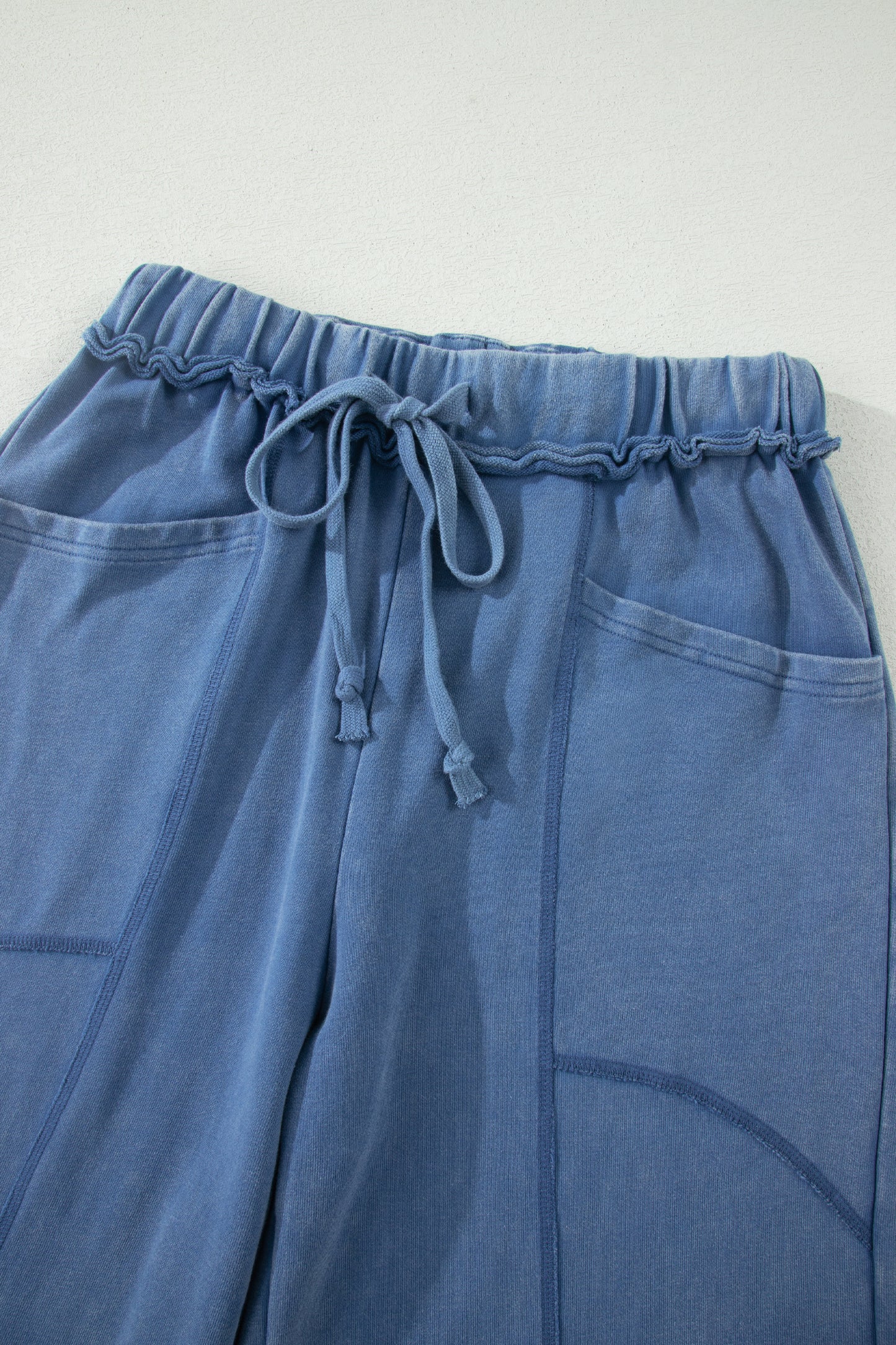 Dusty Blue washed cotton wide leg pants with drawstring waist, oversized patch pockets, and relaxed fit.
