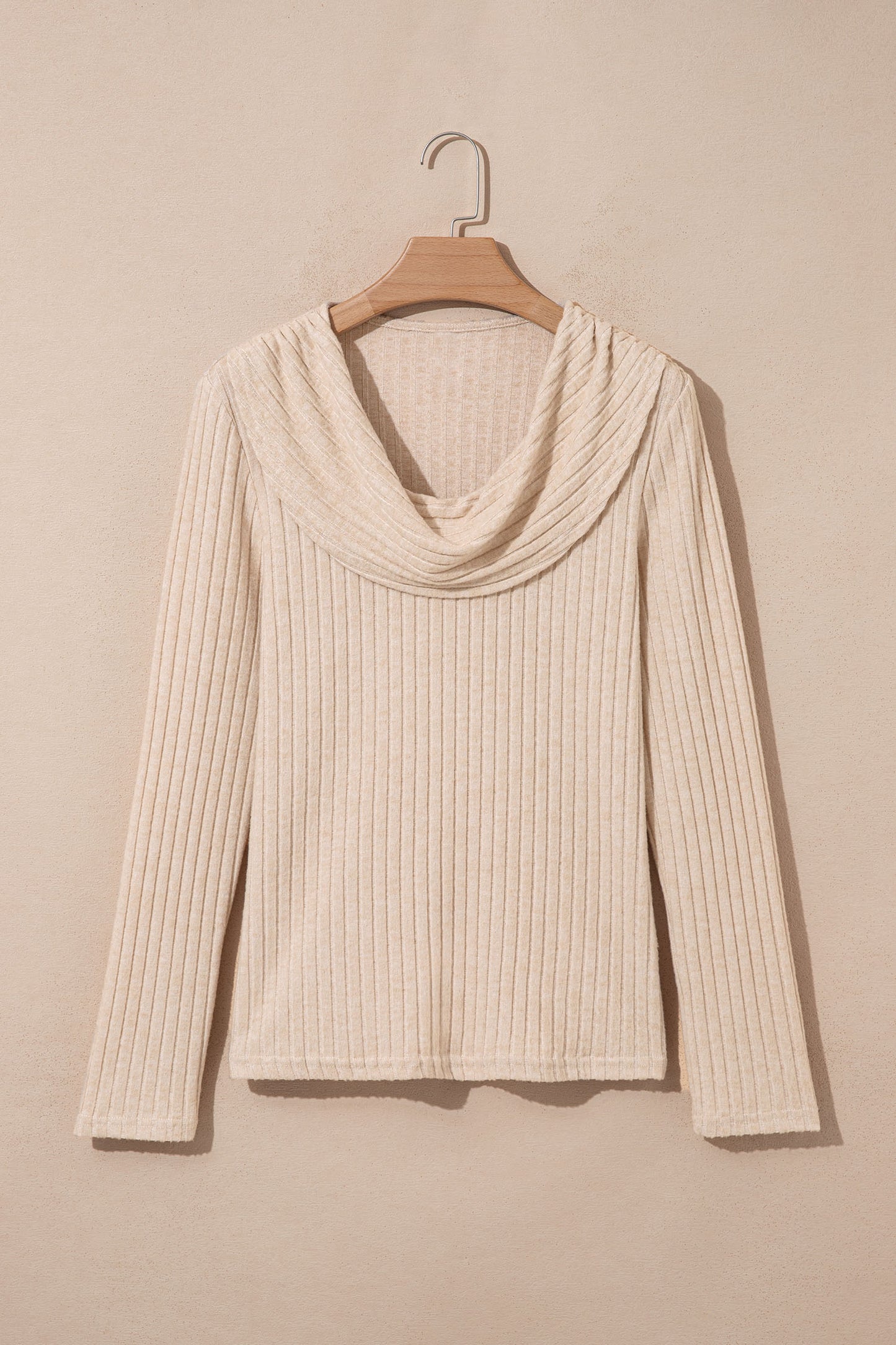 Oatmeal women's long sleeve top with fine vertical ribbed texture, a softly draped cowl neckline, and a flattering fitted silhouette.