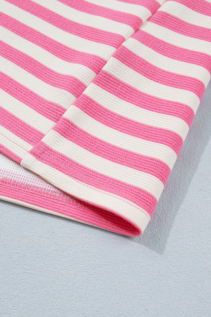 Pink and white textured striped knit short sleeve top with blue contrast ribbed neckline and sleeve cuffs, relaxed fit, and crew neckline.