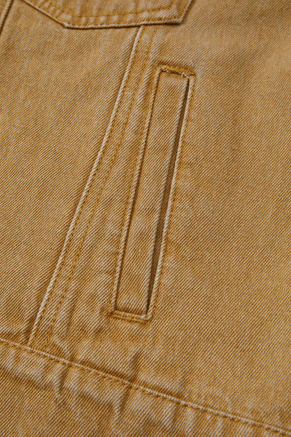 Tan women's denim jacket with metal button front, collared neckline, long sleeves, patch pockets, and relaxed fit.