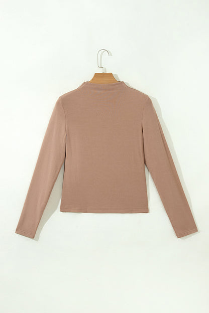 Warm taupe fitted high neck long sleeve top with a smooth stretch-knit finish and regular-length hem.