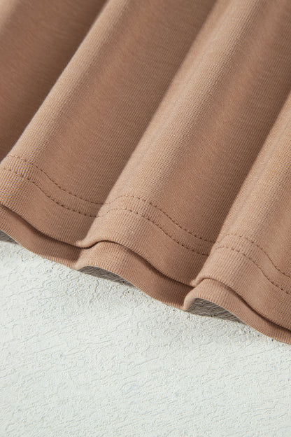 Warm taupe fitted high neck long sleeve top with a smooth stretch-knit finish and regular-length hem.