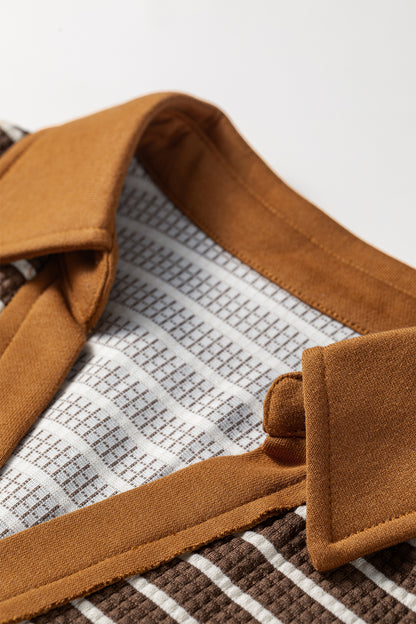 Cocoa Caramel and ivory striped colorblock pullover with a collared V-neckline, dropped shoulders, and long paneled sleeves.