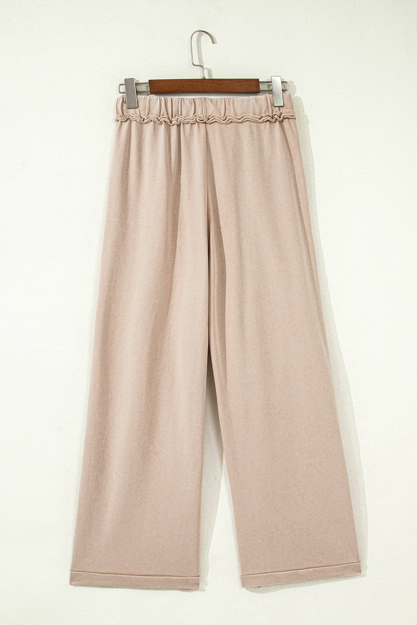 Sand washed cotton wide leg pants with drawstring waist, oversized patch pockets, and relaxed fit.