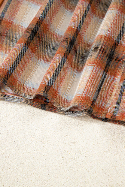 Caramel plaid tunic shirt dress with collared neckline, button front, chest pockets, long sleeves, and relaxed mini silhouette.