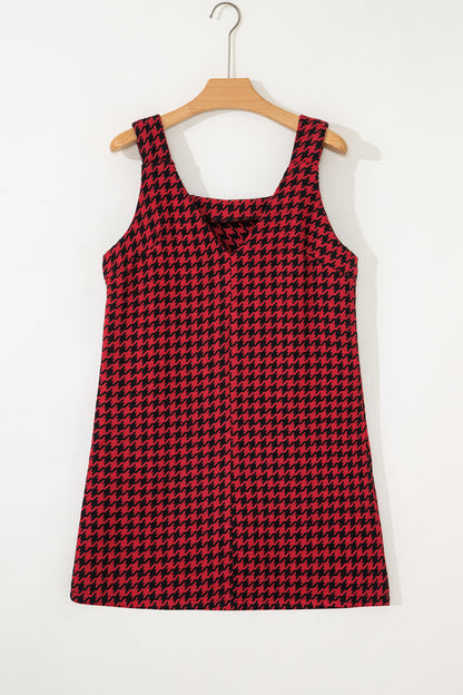 Red textured houndstooth jacquard sleeveless mini dress with V-neckline and A-line silhouette.