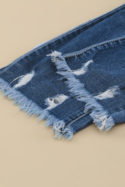 Medium wash blue distressed slim straight leg jeans with drawstring elastic waist and raw hem