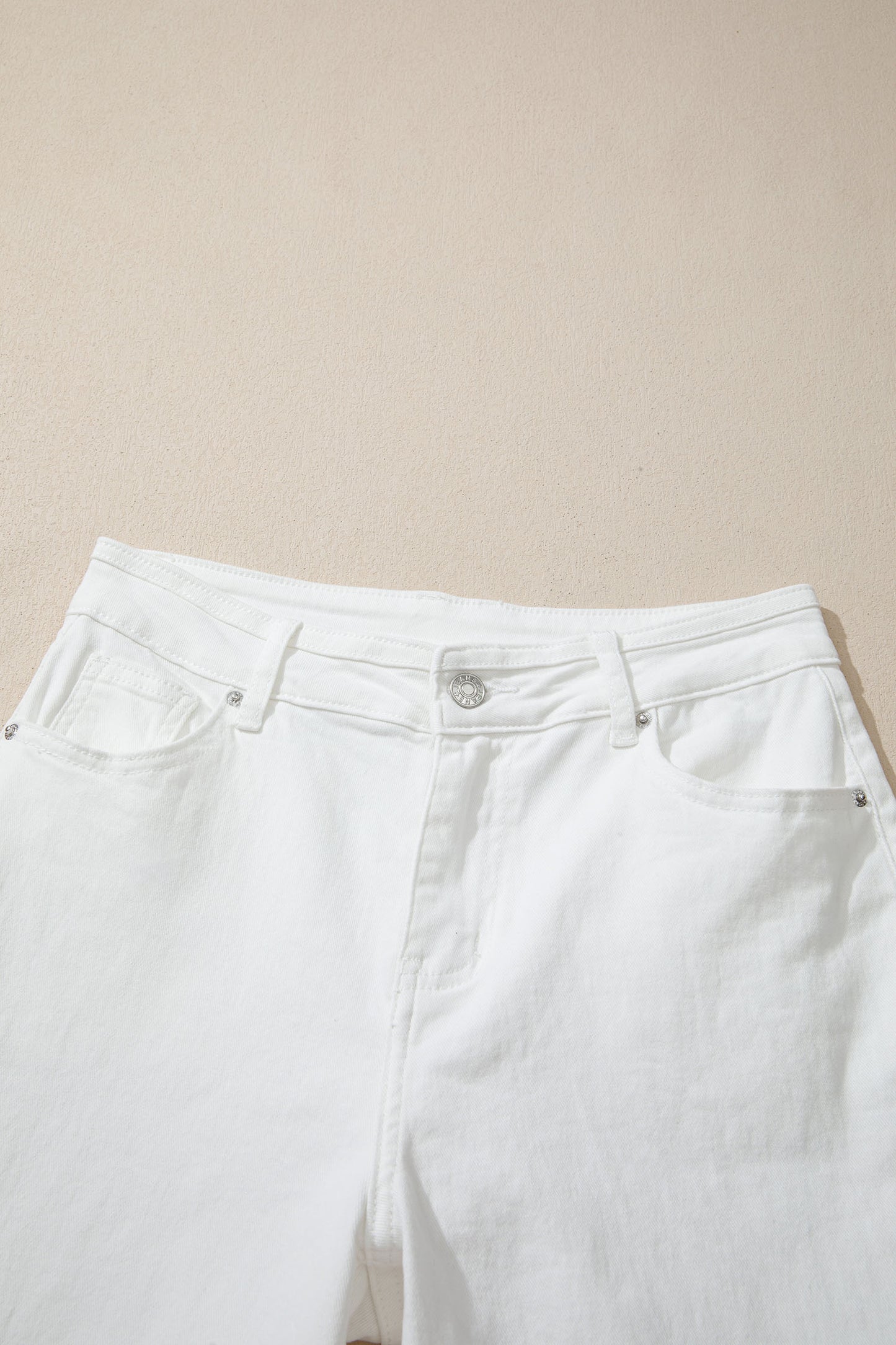Women’s white high-waist wide-leg jeans with classic five-pocket styling and a relaxed full-length silhouette