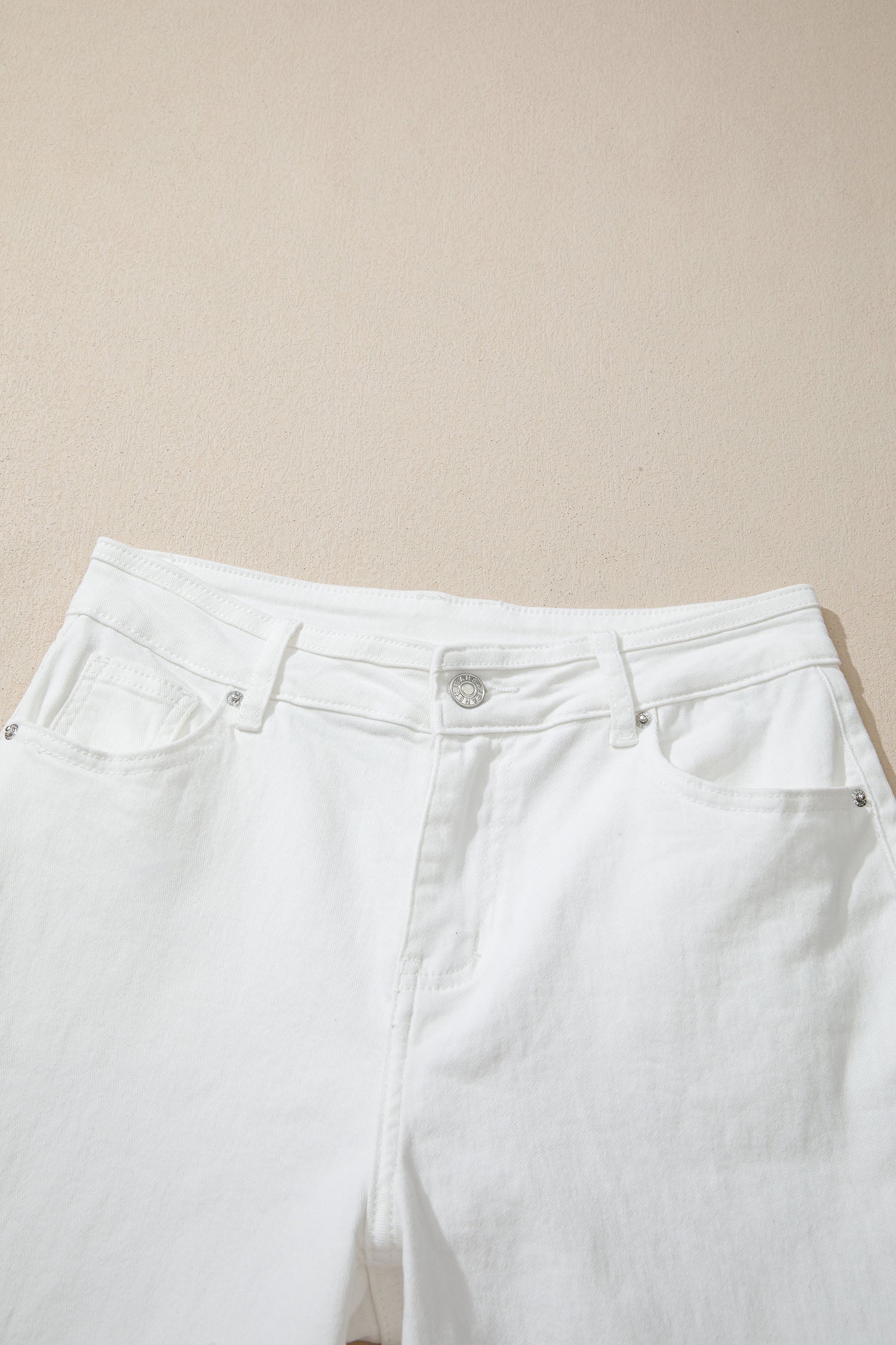 Women’s white high-waist wide-leg jeans with classic five-pocket styling and a relaxed full-length silhouette