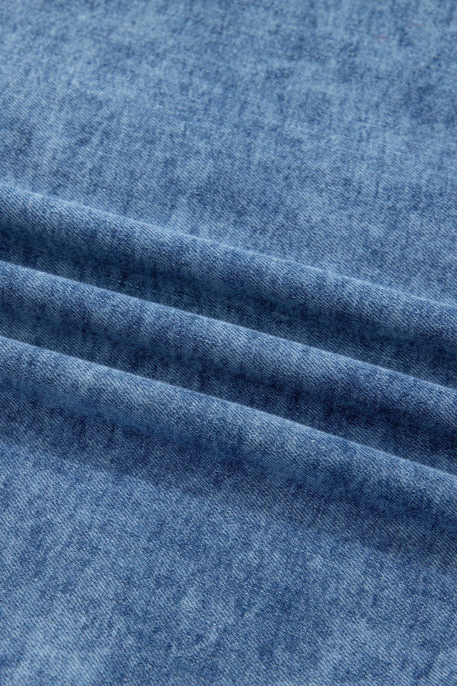 Women's Vintage Denim Wash Acid Wash Sleeveless Denim Button-Up Tank Top featuring a collared neckline, snap button front, western yoke, flap chest pockets, and curved hem.