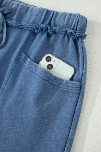 Dusty Blue washed cotton wide leg pants with drawstring waist, oversized patch pockets, and relaxed fit.