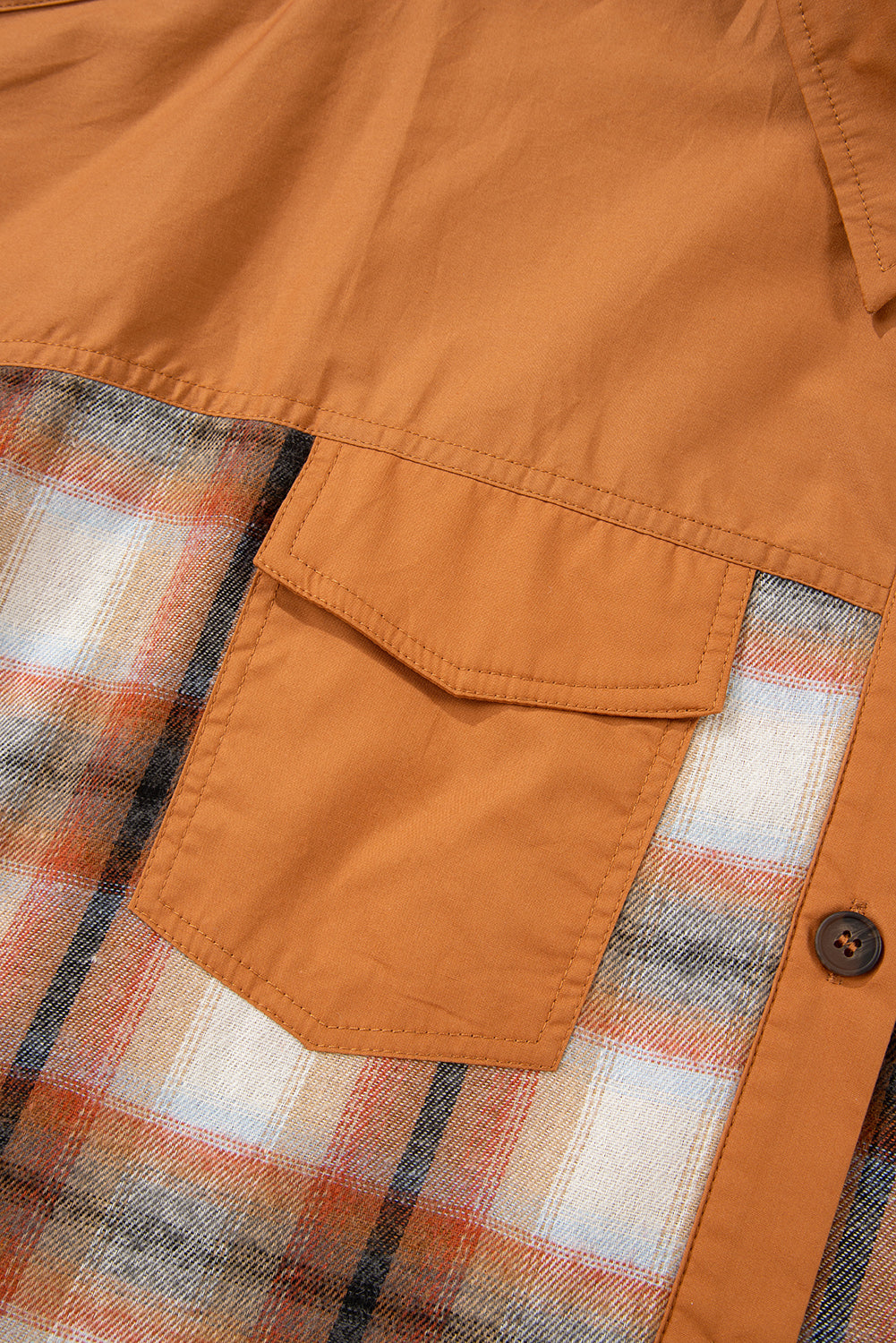 Caramel plaid tunic shirt dress with collared neckline, button front, chest pockets, long sleeves, and relaxed mini silhouette.