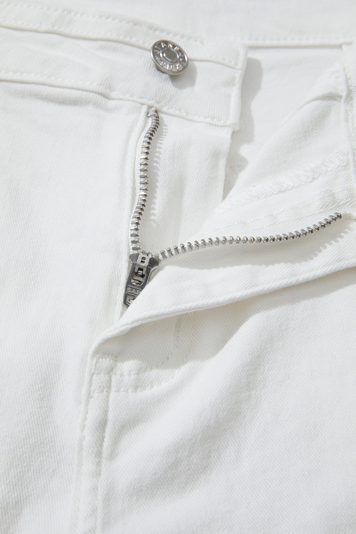 Women’s white high-waist wide-leg jeans with classic five-pocket styling and a relaxed full-length silhouette
