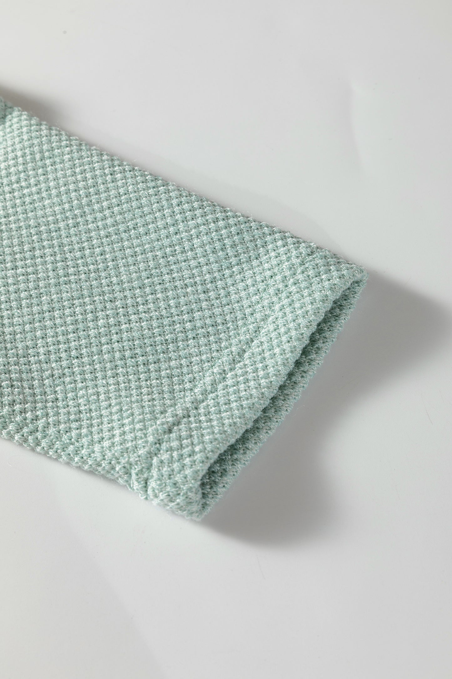 Seafoam Mist textured raglan long sleeve top with round neckline, relaxed fit, and curved hem