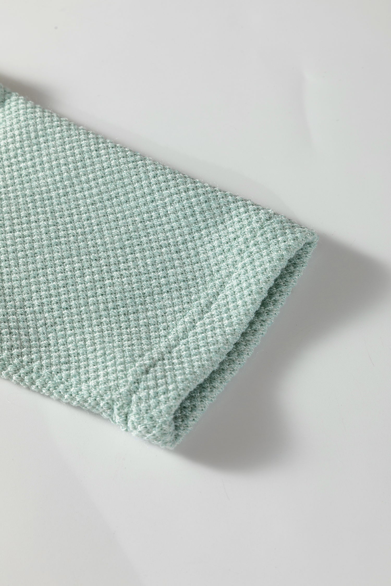 Seafoam Mist textured raglan long sleeve top with round neckline, relaxed fit, and curved hem
