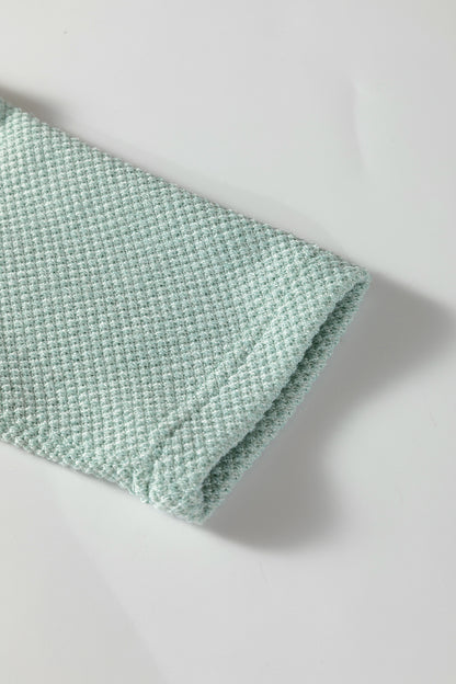 Seafoam Mist textured raglan long sleeve top with round neckline, relaxed fit, and curved hem