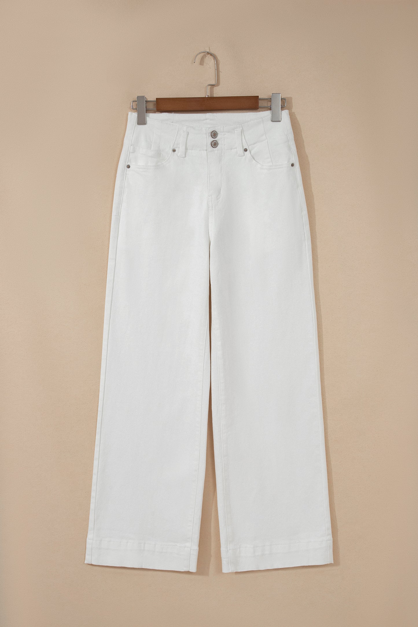 White high rise wide leg jeans with double-button waistband, front pockets and cropped hem.