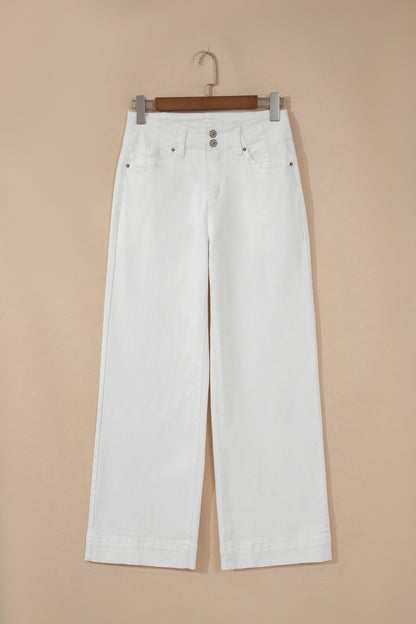 White high rise wide leg jeans with double-button waistband, front pockets and cropped hem.