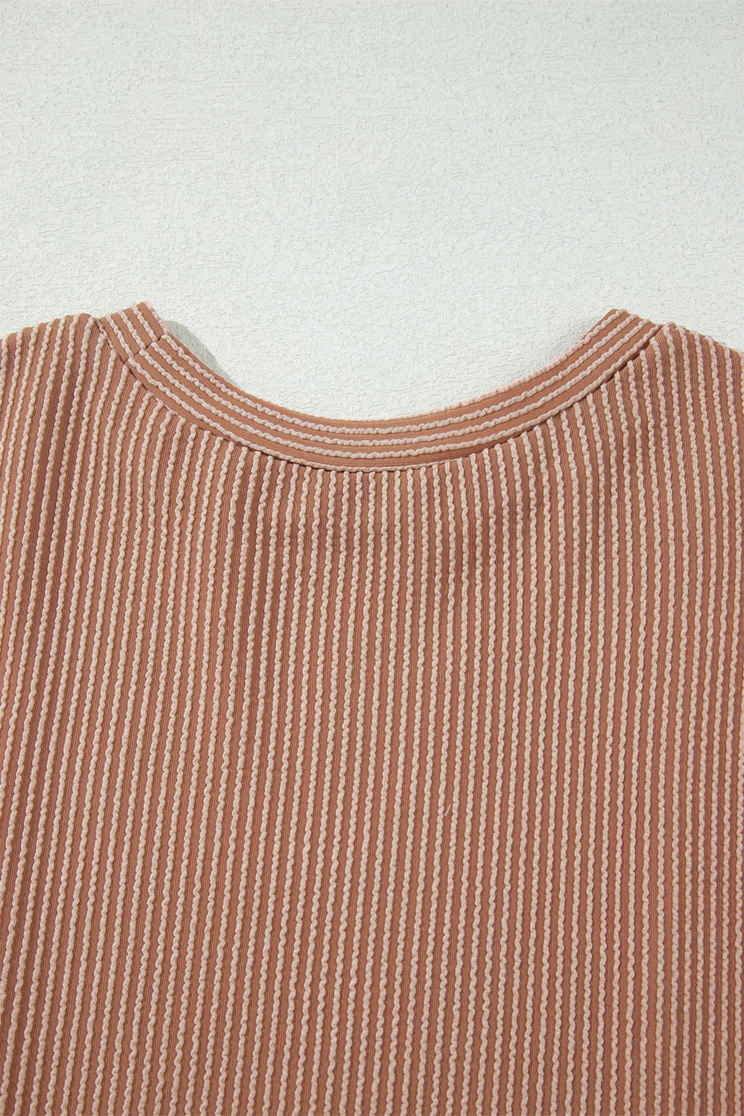 mocha brown leopard colorblock ribbed knit top with a round neckline, dropped shoulders, relaxed fit, and long sleeves.