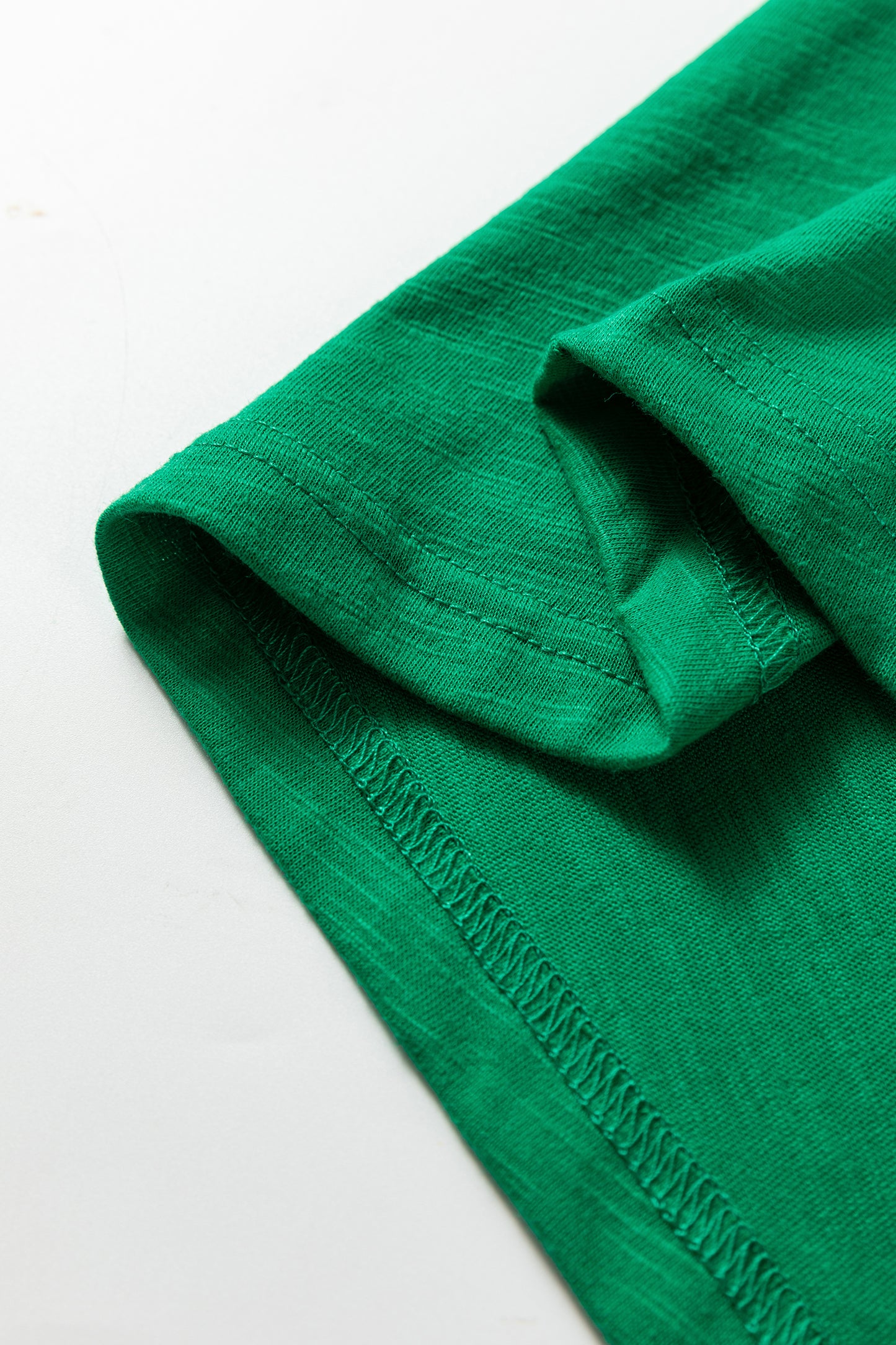 Emerald Green split neck button detail long sleeve top with gathered cuff sleeves