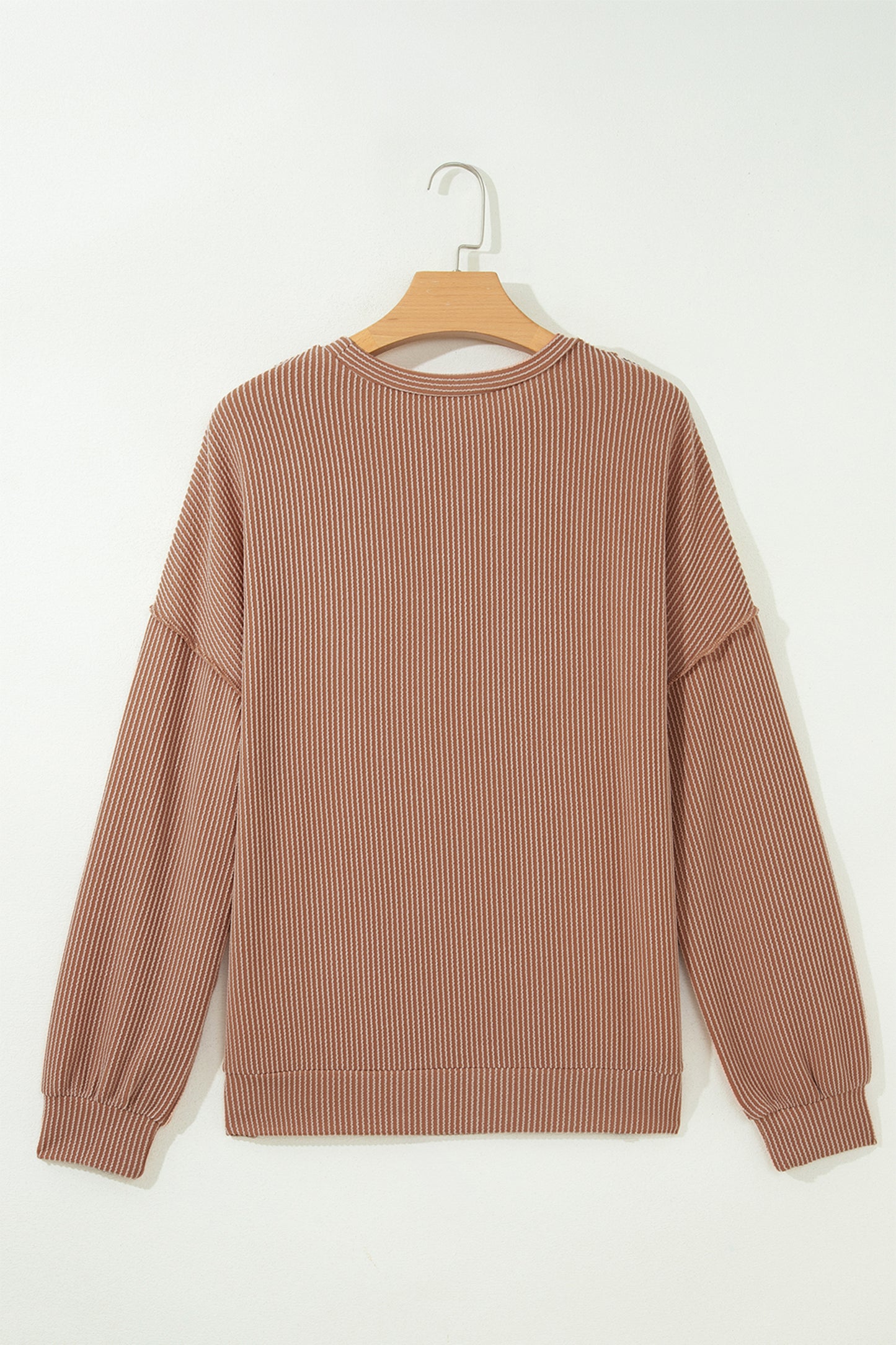 mocha brown leopard colorblock ribbed knit top with a round neckline, dropped shoulders, relaxed fit, and long sleeves.