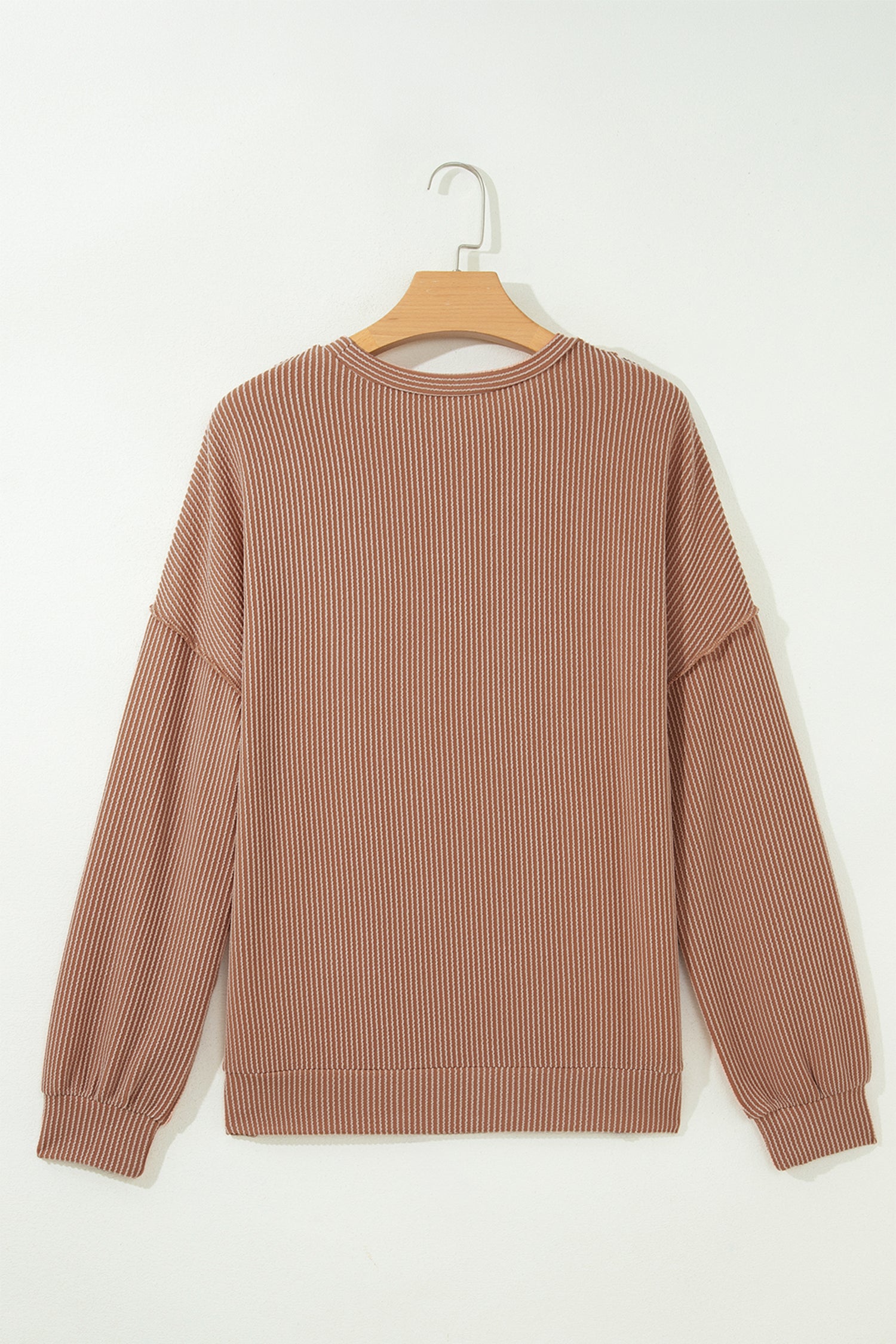 mocha brown leopard colorblock ribbed knit top with a round neckline, dropped shoulders, relaxed fit, and long sleeves.