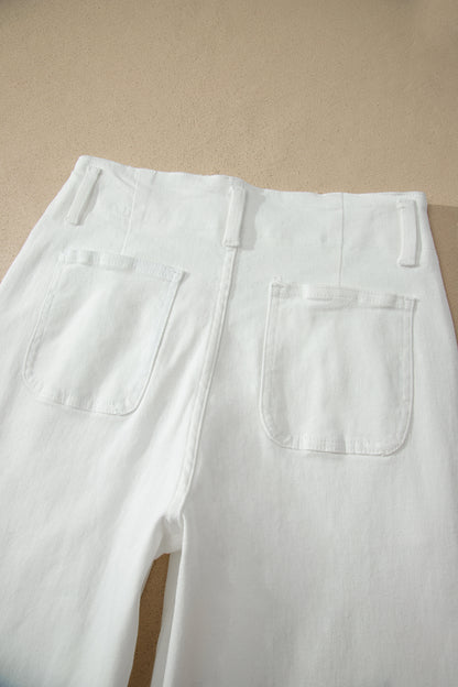 White high rise wide leg jeans with double-button waistband, front pockets and cropped hem.