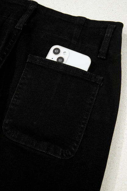 Black high rise wide leg jeans with double-button waistband, front pockets and cropped hem.