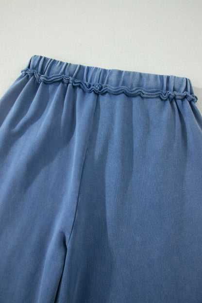 Dusty Blue washed cotton wide leg pants with drawstring waist, oversized patch pockets, and relaxed fit.