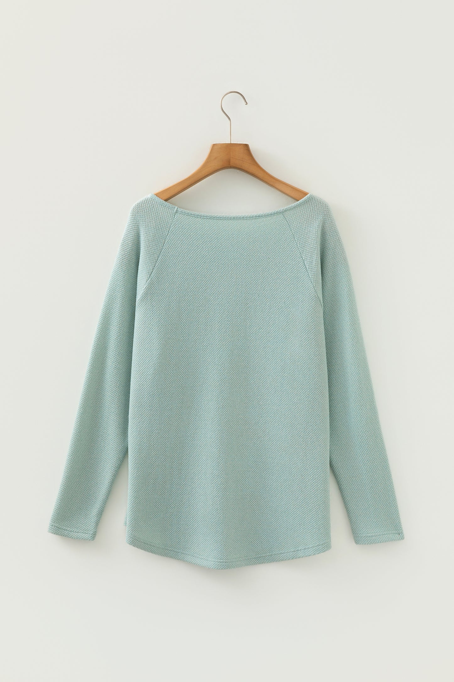 Seafoam Mist textured raglan long sleeve top with round neckline, relaxed fit, and curved hem