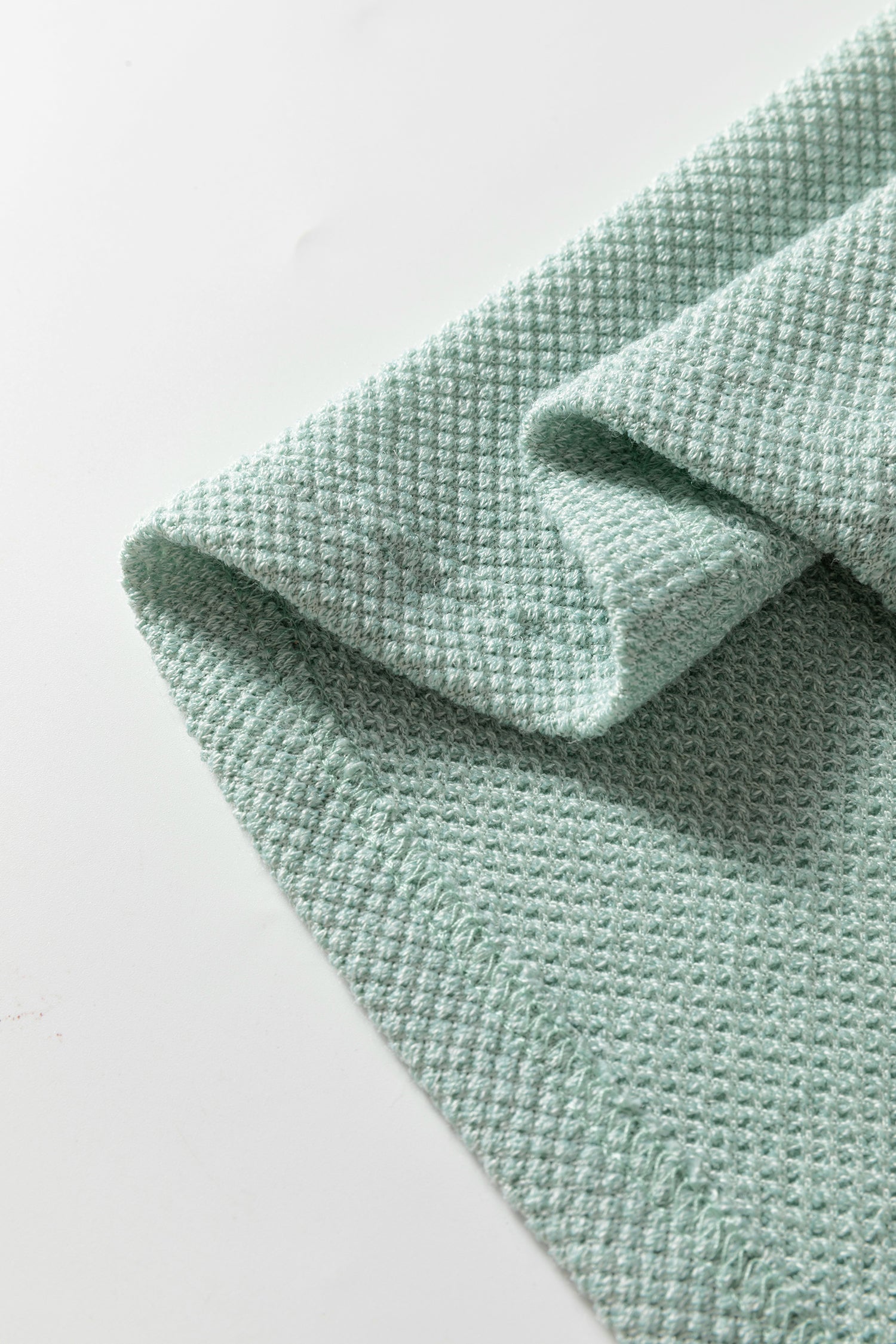 Seafoam Mist textured raglan long sleeve top with round neckline, relaxed fit, and curved hem