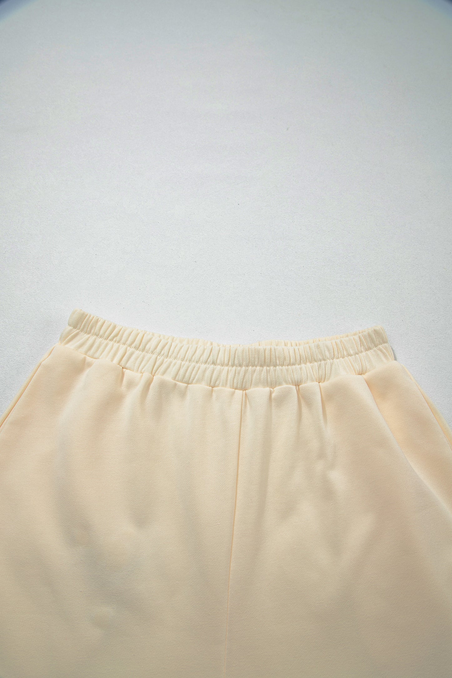 Cream Game Day embroidered sweatshirt and matching drawstring shorts set featuring long sleeves, blue contrast trim, relaxed fit, and casual sporty style.