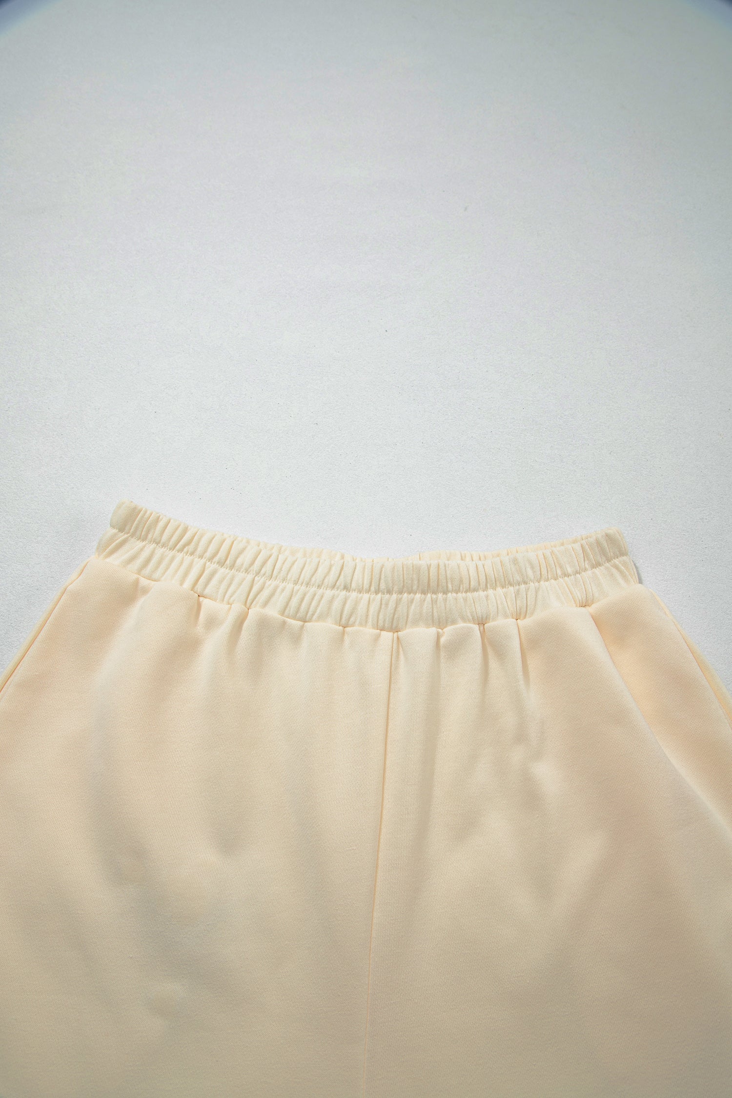 Cream Game Day embroidered sweatshirt and matching drawstring shorts set featuring long sleeves, blue contrast trim, relaxed fit, and casual sporty style.