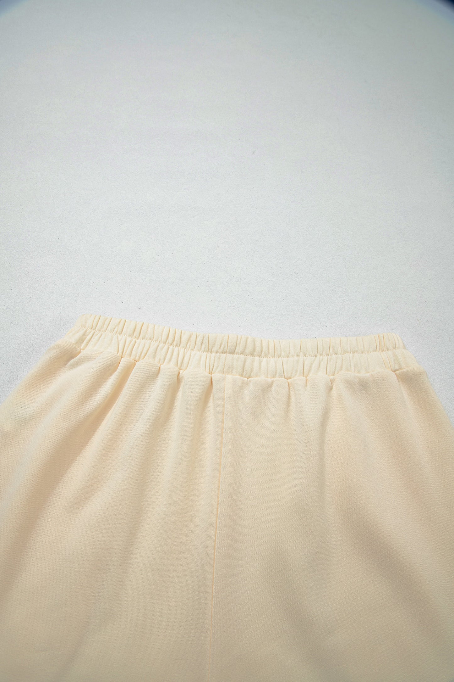 Cream Game Day embroidered sweatshirt and matching drawstring shorts set featuring long sleeves, blue contrast trim, relaxed fit, and casual sporty style.