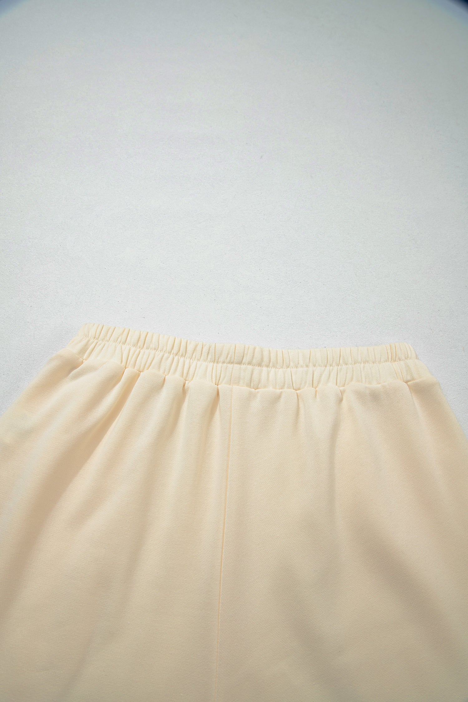 Cream Game Day embroidered sweatshirt and matching drawstring shorts set featuring long sleeves, blue contrast trim, relaxed fit, and casual sporty style.